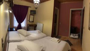 Postel nebo postele na pokoji v ubytování Guesthouse Sinoi