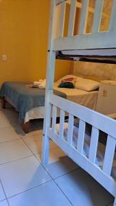 a bedroom with a bunk bed and a bunk bed at Pousada Cabocla in Alter do Chao