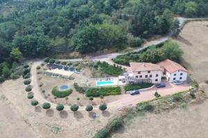 an aerial view of a house with a yard at Gîte la Madeleine dans les gorges de la Loire in Dancé
