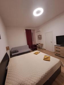 Ένα ή περισσότερα κρεβάτια σε δωμάτιο στο Rooms Near Sea +32 φωτογραφίες