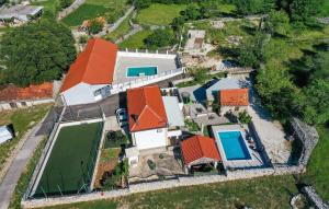 an overhead view of a house with orange roofs at Nice Home In Trolokve in Prgomet +27 photos