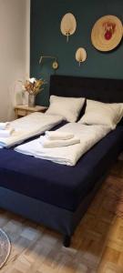 a large bed in a bedroom with a blue mattress at The Dream Villa in Rødby