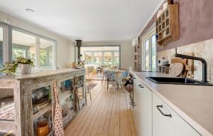 a kitchen with a sink and a counter top at 3 Bedroom Beautiful Home In Nykøbing Sj in Nyrup +6 photos
