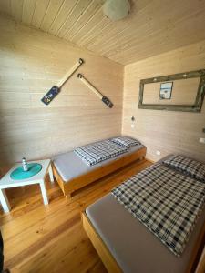 Postel nebo postele na pokoji v ubytování Domki Zuzanna