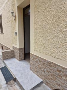 a hallway of a building with a door at Casa Mia in Scilla +2 photos