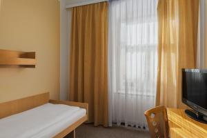 TV a/nebo společenská místnost v ubytování Spa Hotel Goethe