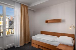 Postel nebo postele na pokoji v ubytování Spa Hotel Goethe