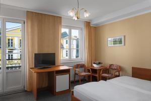 TV a/nebo společenská místnost v ubytování Spa Hotel Goethe