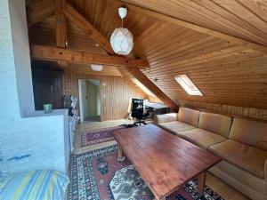 a room with a couch and a table in a cabin at Villa Laura in Lausanne