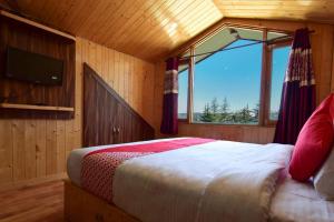 Ένα ή περισσότερα κρεβάτια σε δωμάτιο στο Gulmarg Height Homestay, Kufri-HP