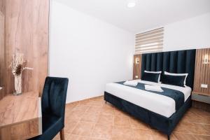 Postel nebo postele na pokoji v ubytování CORONA Apartments