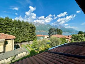 a view of the lake from the roof of a house at Bellagio Neighbor Apartment in Limonta