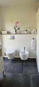 a white bathroom with a sink and a toilet at The Dream Villa in Rødby +44 photos