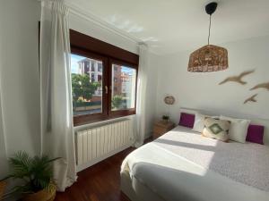Postel nebo postele na pokoji v ubytování Piso Sopela Playas