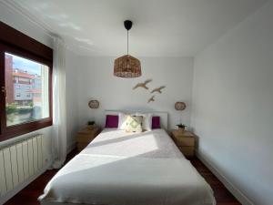 Postel nebo postele na pokoji v ubytování Piso Sopela Playas