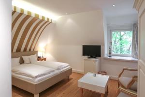Postel nebo postele na pokoji v ubytování Landhaus am See