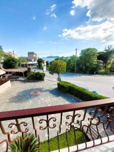 a balcony with a view of a parking lot at Villa Nickolas in Paleo Tsifliki