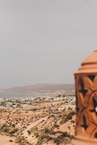 a view of a beach with buildings in the distance at Panorama Guesthouse in Agadir