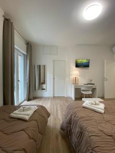 Postel nebo postele na pokoji v ubytování B&B Campus Suites Bari