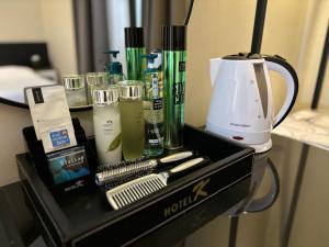 a black box with makeup products on a table at Cheonan K Hotel in Cheonan