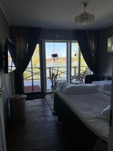 Postel nebo postele na pokoji v ubytování Björkö Hus