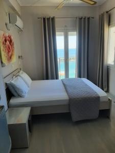 ピタゴリオにあるOLYMPIADA View 1のベッドルーム1室(ベッド1台付)が備わります。