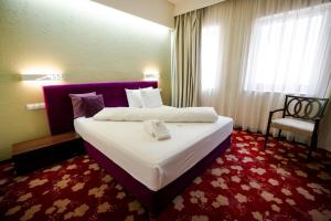 Voodi või voodid majutusasutuse Hotel Relax Craiova toas