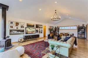 a living room with a couch and a fireplace at Nederland Mountain Haven bungalow in Nederland
