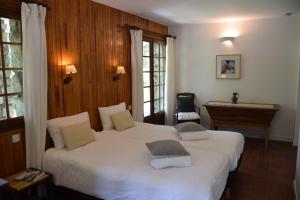 Łóżko lub łóżka w pokoju w obiekcie Chalet L Olan 15p Emplacement exceptionnel grand terrain