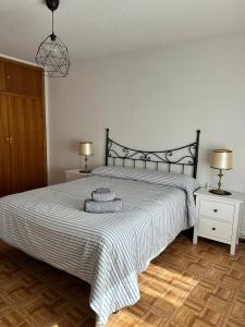 a bedroom with a large bed and two night stands at Escondite de Julia in Mijares +32 photos