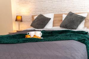 Posteľ alebo postele v izbe v ubytovaní Triton Apartments