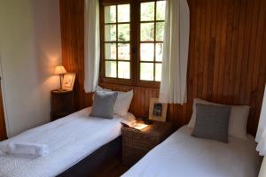 Łóżko lub łóżka w pokoju w obiekcie Chalet L Olan 15p Emplacement exceptionnel grand terrain