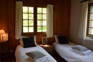 Łóżko lub łóżka w pokoju w obiekcie Chalet L Olan 15p Emplacement exceptionnel grand terrain