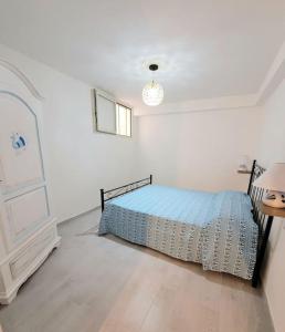 Ένα ή περισσότερα κρεβάτια σε δωμάτιο στο Casa Narciso Villasimius