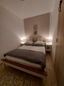 Voodi või voodid majutusasutuse Három Testvér Apartman toas