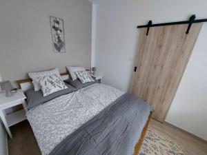 Voodi või voodid majutusasutuse Három Testvér Apartman toas