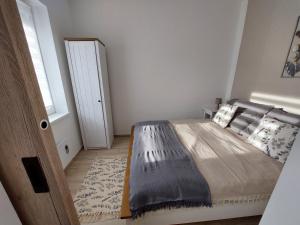 Voodi või voodid majutusasutuse Három Testvér Apartman toas