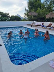a group of people in a swimming pool at Casa El Sueño in Jávea