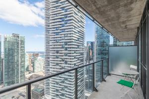 an apartment balcony with a view of a skyscraper at GLOBALSTAY Maple Leaf Square in Toronto