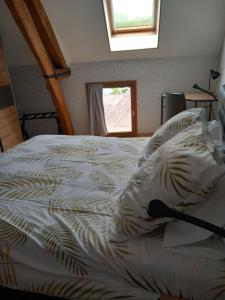 a white bed in a room with a window at Syb'elle étape in Thury-sous-Clermont +12 photos