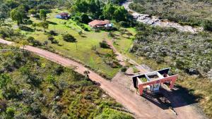 an aerial view of a house on a road at Cachoeiras Pé da Serra in São João Batista do Glória