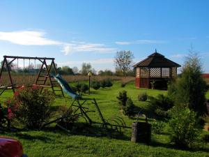a playground with a slide and a gazebo at Zajazd Okalina in Opatów