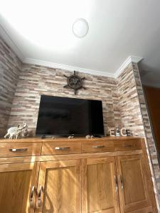 TV a/nebo společenská místnost v ubytování Casa Yanira