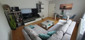 TV a/nebo společenská místnost v ubytování 4****Sterne Ferienwohnung Mia DTV Klassifizierung