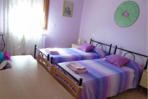 Voodi või voodid majutusasutuse Agriturismo Camera Rosa toas
