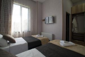 Postel nebo postele na pokoji v ubytování Prestige Guest House