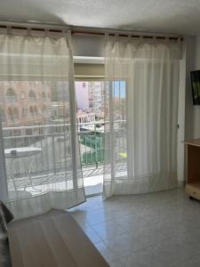 Televízia a/alebo spoločenská miestnosť v ubytovaní Encantador piso cerca de la playa en Cullera