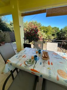 a table with a table cloth with food on it at Maison Pelops Petalidi in Petalidi