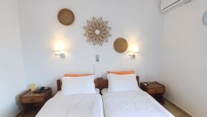 Ένα ή περισσότερα κρεβάτια σε δωμάτιο στο Hotel Beach Amaryllis