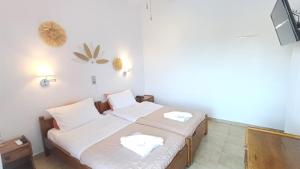 Ένα ή περισσότερα κρεβάτια σε δωμάτιο στο Hotel Beach Amaryllis